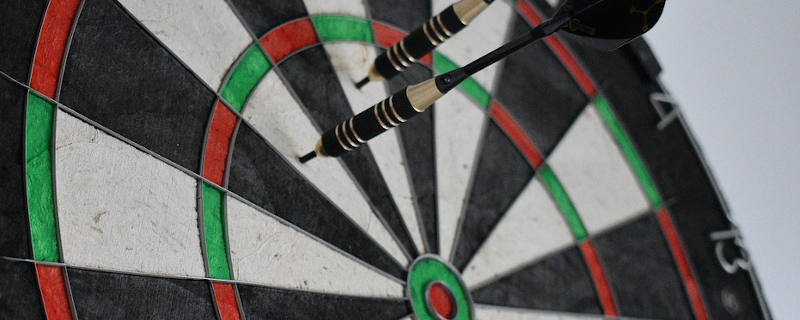 An example of a dart left in a steel-tip (bristle) dartboard.